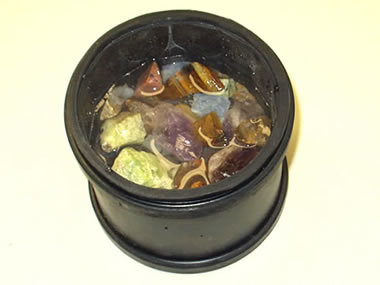 Rocks and water in tumbler barrel