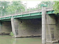 vertical pipe gage on bridge