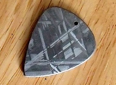 polished meteorite guitar pick