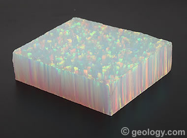 a block of synthetic opal showing the columnar growth pattern