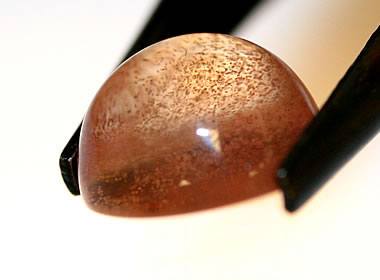 sunstone cabochon with copper