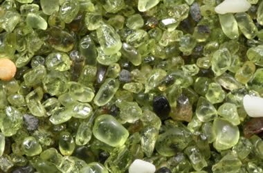 Olivine: A rock-forming mineral. Used as the gemstone peridot.